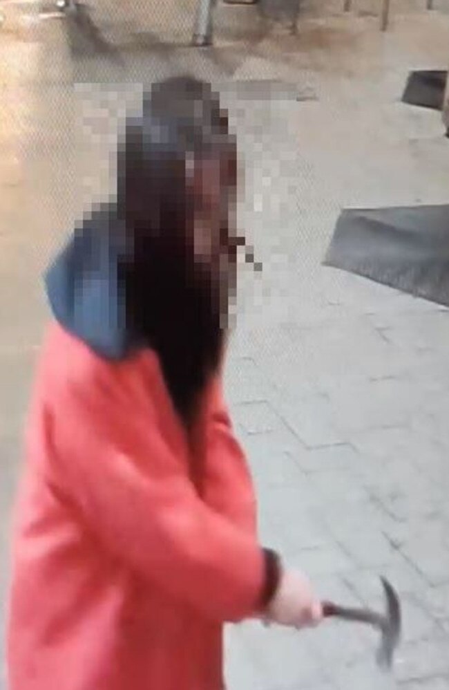 CCTV footage shows the moment a woman allegedly smashed more than 25 shop windows in Brisbane St Mall in Launceston on Thursday, May 11.