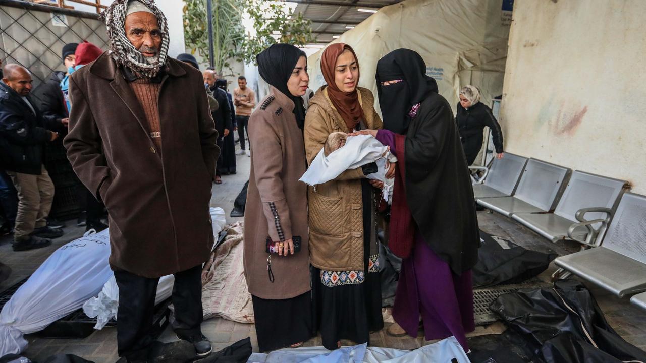 People mourn as they receive the dead bodies of victims of an Israeli strike in Rafah, Gaza. Picture: Getty Images