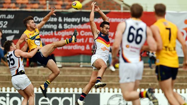 Eagles’ Thomas Gray and Adelaide's Domenico Costanzo fly for the ball. Picture: Tom Huntley