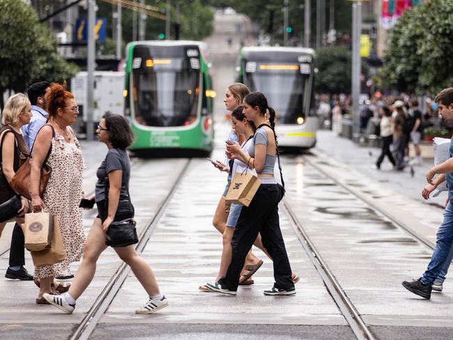 MELBOURNE, AUSTRALIA - NCA NewsWire Photos - 13 DECEMBER, 2023: People carry shopping bags while walking along Bourke Street Mall in Melbourne. Picture: NCA NewsWire / Diego Fedele