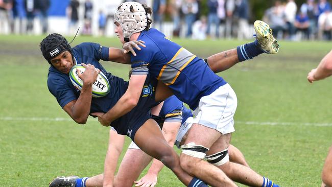 Brisbane Grammar School’s Shannon Simpson is tackled. Picture, John Gass