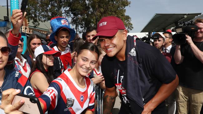 Latrell Mitchell pictured with a fan at the Sydney Roosters fan morning at Moore Park after the Roosters win in the 2019 NRL Grand Final. Picture: Richard Dobson