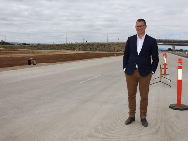 Liberal Party Minister Stephan Knoll  representing the seat of Schubert for South Australia discussing - The North South Corridor Northern Connector Project which is scheduled to me opened in March 2020 - at a Community event in the hub at the Waterloo Corner Interchange Overpass. Families and locals enjoyed a drive or bus trip along a stretch of the Express way as well as free sausage sizzle, donuts, face-painting, a virtual reality experience and a welcome to country by Jack Buckskin and the Puma Kaaru dance group and a chance to explore up close fire fighting trucks and some of the heavy machinery used on the project. Photographer Emma Brasier/AAP