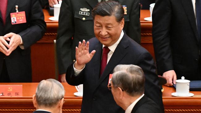 Xi Jinping leaves the opening session of the 20th Chinese Communist Party Congress at the Great Hall of the People in Beijing on Sunday. Picture: AFP