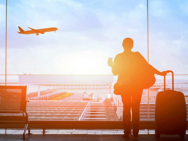 happy traveler waiting for the flight in airport, departure terminal, immigration concept