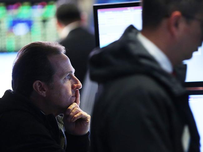 NEW YORK, NY - DECEMBER 03: Traders work on the floor of the New York Stock Exchange (NYSE) in afternoon trading on December 3, 2015 in New York City. The Dow Jones industrial average is down over 120 points in afternoon trading on news that the European Central Bank's new stimulus plan is not as aggressive as some investors had hoped. Spencer Platt/Getty Images/AFP == FOR NEWSPAPERS, INTERNET, TELCOS & TELEVISION USE ONLY ==