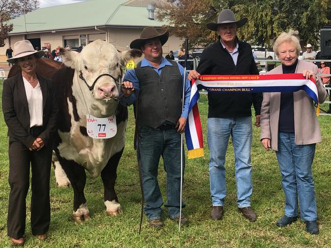 Grand champion Hereford bull Kymarney Maverick Q009 at the Hereford National Show and Sale at Wodonga with judge Erica Halliday, handler Hayden Green, Kymarney principal Scott Lewington and Herefords Australia chair Trish Worth. For The Weekly Times. May 12, 2021. Picture: Fiona Myers