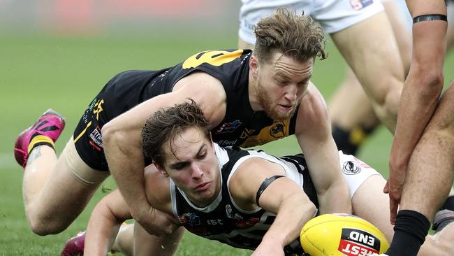 Port Adelaide’s Boyd Woodcock under pressure from Michael Virgin Picture SARAH REED