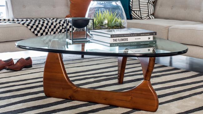 A coffee table adds bold curves to the decor.