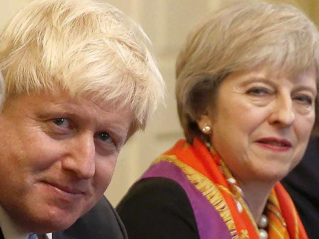 (FILES) In this file photo taken on November 28, 2016, British Prime Minister Theresa May (R) sits with members of her cabinet British Secretary of State for Exiting the European Union (Brexit Minister) David Davis (L) and British Foreign Secretary Boris Johnson in the Cabinet Room inside 10 Downing Street in central London. British Foreign Secretary Boris Johnson has resigned, Downing Street said in a statement on July 9, 2018, hours after Brexit minister David Davis stepped down. / AFP PHOTO / POOL / PETER NICHOLLS