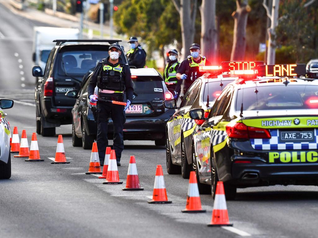 Police pull vehicles aside at a checkpoint in Melbourne. Picture: William West/AFP