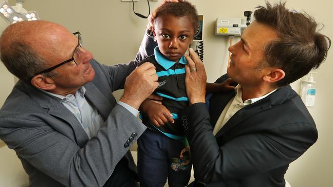 Royal Children's Hospital cranofacial surgeon Tony Holmes and plastic surgeon Jonathan Burge check on Jack. Picture: Alex Coppel