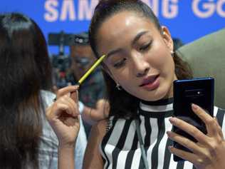 World media and the interested public come to grips with the new Samsung Galaxy Note 9 and its distinctive pen. Picture: David Kirkpatrick