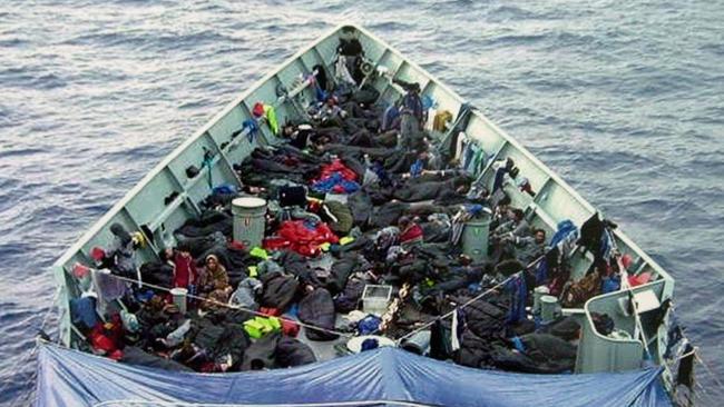 Asylum seekers aboard HMAS Adelaide after being rescued from a sinking boat in 2001.