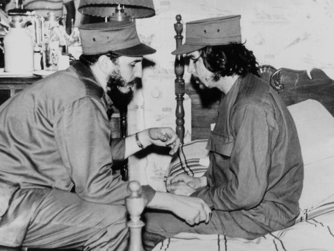 Fidel Castro (left), then 33 years old, chats with 31-year-old Ernesto "Che" Guevara, at his barracks in Havana, shortly after both led the revolution that overthrew the Batista regime. Picture AFP