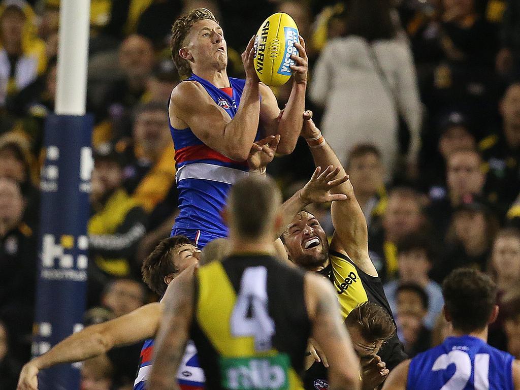 Bulldog Aaron Naughton soars over Richmond’s defence. Picture: Michael Klein