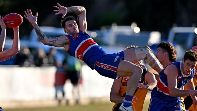 EDFL: Keilor’s Jesse Wallin cames crashing to the ground. Picture: Andy Brownbill