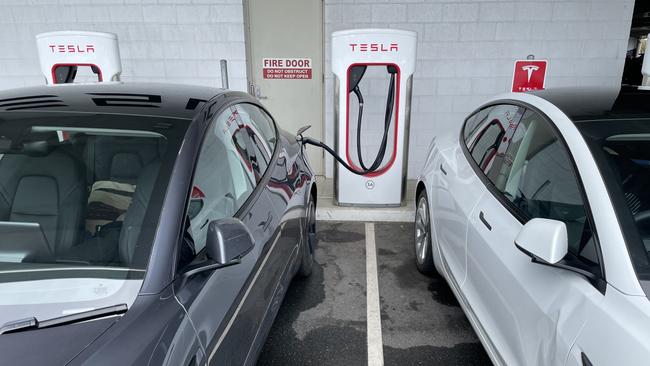 The Tesla charging station at Park Beach, Coffs Harbour, normally has plenty of vacant bays – but not today. Picture: Chris Knight