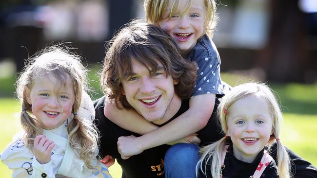 Western Bulldogs AFL player Liam Picken and his three kids Malachy, 6, Delphine, 4 (on left) and Cheska, 4t. Picture: Alex Coppel