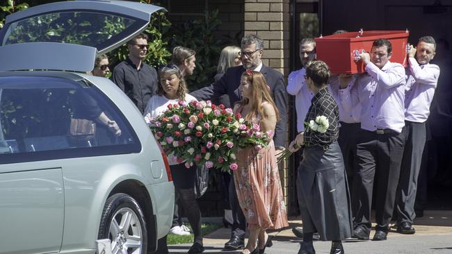 Emotional relatives grieve outside the chapel at Helena Broadbent’s funeral as the casket is removed. Picture: Tony Gough