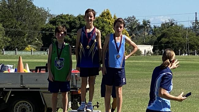 Redlands College cross country runner Zachary Walker, middle.