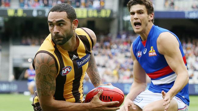 AFL. Round 3. 31/03/2019.  Hawthorn vs Western Bulldogs at the MCG.  Hawthorns Shaun Burgoyne  turns Bulldog Lewis Young  inside out    . Pic: Michael Klein.