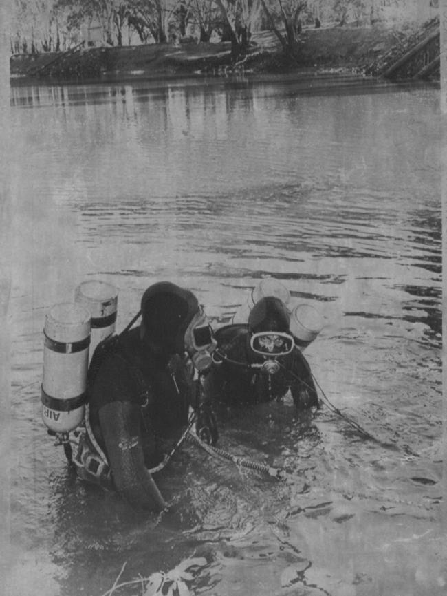 Police divers search an area of water in the hope of finding the body of Donald Mackay.