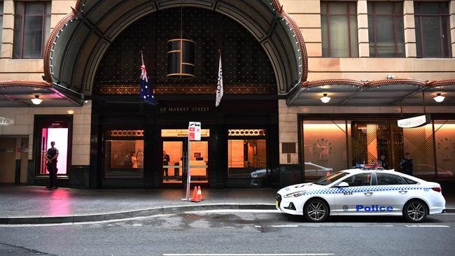 NSW Police stand guard outside the Swissotel Hotel in Market Street, Sydney. Picture: AAP