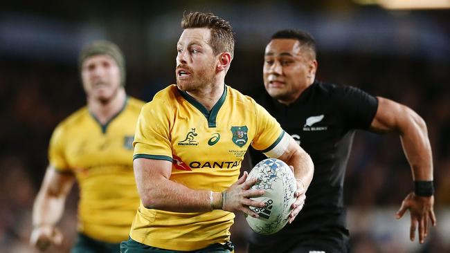 Bernard Foley makes a break for the Wallabies against the All Blacks on Saturday night. Picture: Getty Images