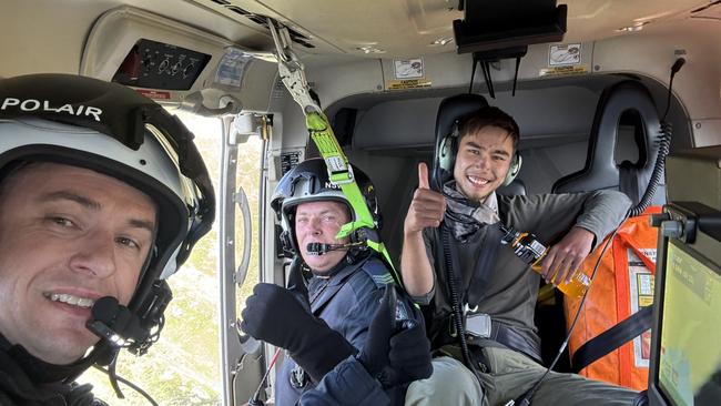 Bushwalker Hadi Nazari poses for a photograph with NSW Police after being found in Kosciuszko National Park by a group of hikers. Picture: NSW Police