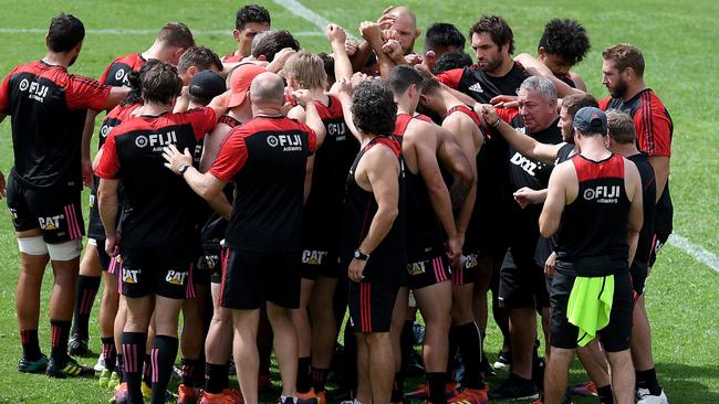 Canterbury Crusaders players and staff come together at training in Sydney on Friday after observing two minutes’ silence to mark the Christchurch terror attacks. Picture: AAP 