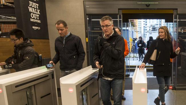 SEATTLE, WA - JANUARY 22: Shoppers scan the Amazon Go app on the mobile devices as the enter the Amazon Go store, on January 22, 2018 in Seattle, Washington. After more than a year in beta Amazon opened the cashier-less store to the public.   Stephen Brashear/Getty Images/AFP == FOR NEWSPAPERS, INTERNET, TELCOS & TELEVISION USE ONLY ==