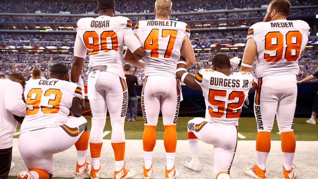 Members of the Cleveland Browns stand and kneel during the national anthem before the game against the Indianapolis Colts at the weekend. Picture: AFP