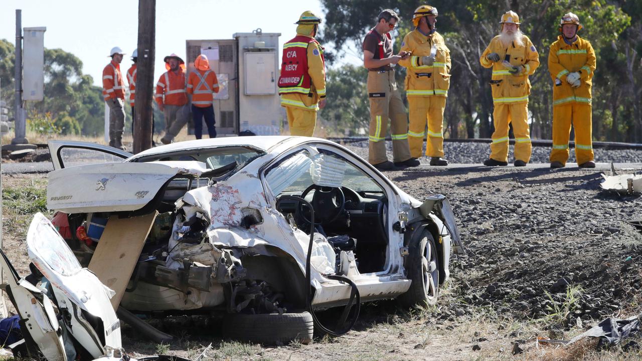 Emergency crews beside the wreckage on Monday afternoon. Picture: Mark Wilson