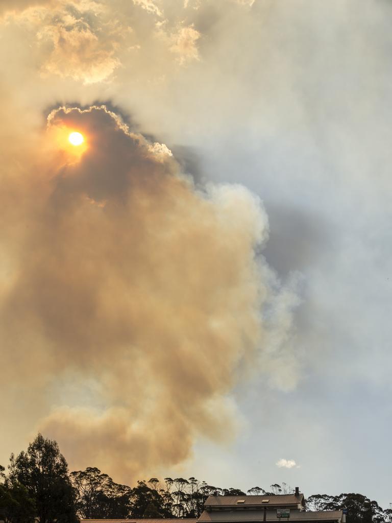 Smoke billows behind the Great Lake pub. Picture: Heath Holden/Getty