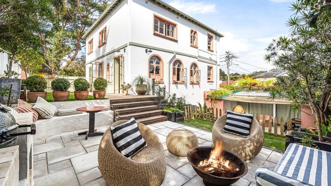 The gardens have been landscaped and feature a barbecue terrace and a firepit area. Picture: realestate.com.au