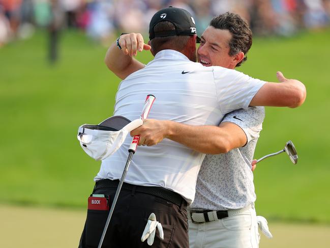 ROCHESTER, NEW YORK - MAY 21: (L-R) Michael Block of the United States, PGA of America Club Professional, and Rory McIlroy of Northern Ireland congratulate each other on the 18th green during the final round of the 2023 PGA Championship at Oak Hill Country Club on May 21, 2023 in Rochester, New York. (Photo by Kevin C. Cox/Getty Images)