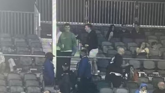 Fans being ejected from the match for abusing players