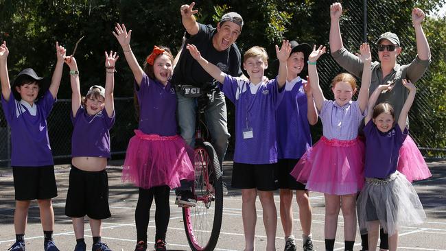 Samuel Johnson with students at Yarra Road Primary School in Croydon North. Picture: George Salpigtidis