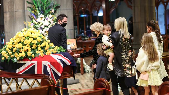 Patti reaches out to touch Bert’s coffin. Picture: David Caird