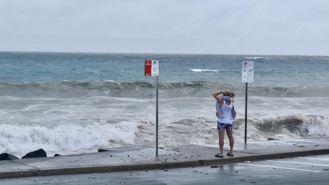 Main beach in Byron Bay remained closed but many visitors and residents decided to go and check out the high tide on Tuesday morning.