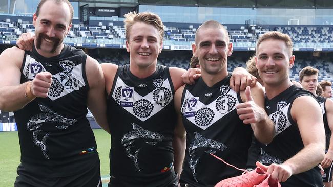 GEELONG, AUSTRALIA - SEPTEMBER 07: Brayden Crossley, Michael Manteit, Jacob Dawson and Boyd Woodcock of the Sharks celebrate after winning the 2024 VFL First Semi Final match between the Geelong Cats and Southport Sharks at GMHBA Stadium on September 07, 2024 in Geelong, Australia. (Photo by Rob Lawson/AFL Photos via Getty Images)