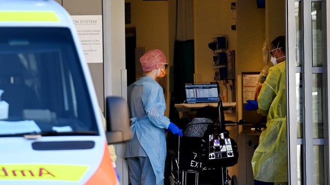 SYDNEY, AUSTRALIA - NewsWire Photos SEPTEMBER 6, 2021: Frontline emergency workers attend to the emergency department at St Vincent Hospital in Sydney as the hospitalisation rate is expected to soar to at least one in 10 people in the coming weeks.Picture: NCA NewsWire / Jeremy Piper