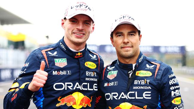 SUZUKA, JAPAN - APRIL 06: Pole position qualifier Max Verstappen of the Netherlands and Oracle Red Bull Racing and Second placed qualifier Sergio Perez of Mexico and Oracle Red Bull Racing celebrate in parc ferme during qualifying ahead of the F1 Grand Prix of Japan at Suzuka International Racing Course on April 06, 2024 in Suzuka, Japan. (Photo by Mark Thompson/Getty Images)