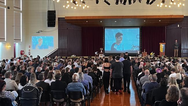 Hundreds of mourners ignored the rain to say goodbye to beloved motocross rider Joel Evans following his devastating death while racing in South Australia in April.
