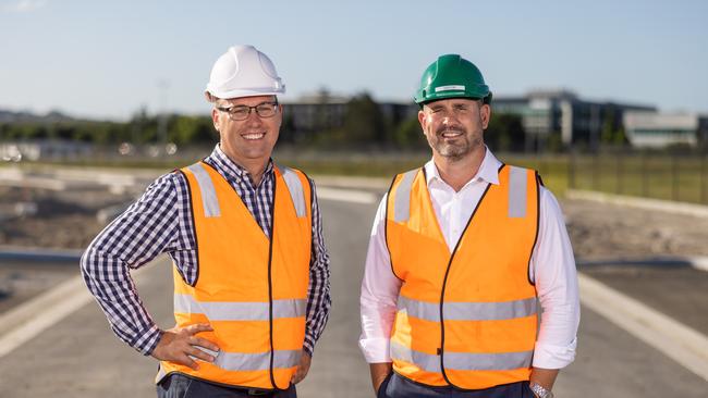 Rino Recyling's Daniel Blaser (left) and Todd Pepper inspecting roadwork using recycled material at Northshore, Hamilton