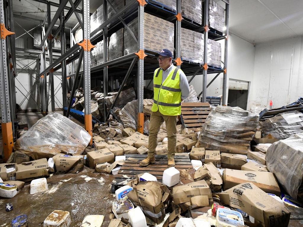 Scott Morrison inspects flood damage at the Norco Ice Cream Factory in Lismore, NSW, on a visit to flood devastated regions in northern NSW where he declared a national emergency. Picture: Dave Hunt/AAP