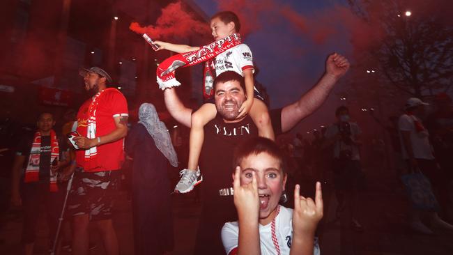 Liverpool fans celebrate as their team clinch the Premier League title.