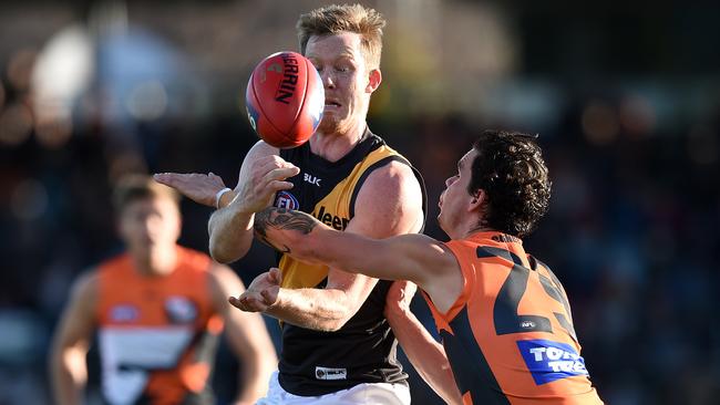 Jack Riewoldt gets the handball off under pressure against the Giants on the weekend, their big loss adding more heat at Punt Rd. Picture: AAP