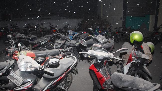 Volcanic ash from the eruption of Mount Kelud covers motorcycles in Kediri, East Java.